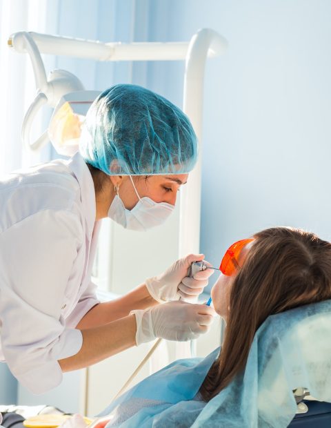 Young woman getting dental treatment. dental clinic.